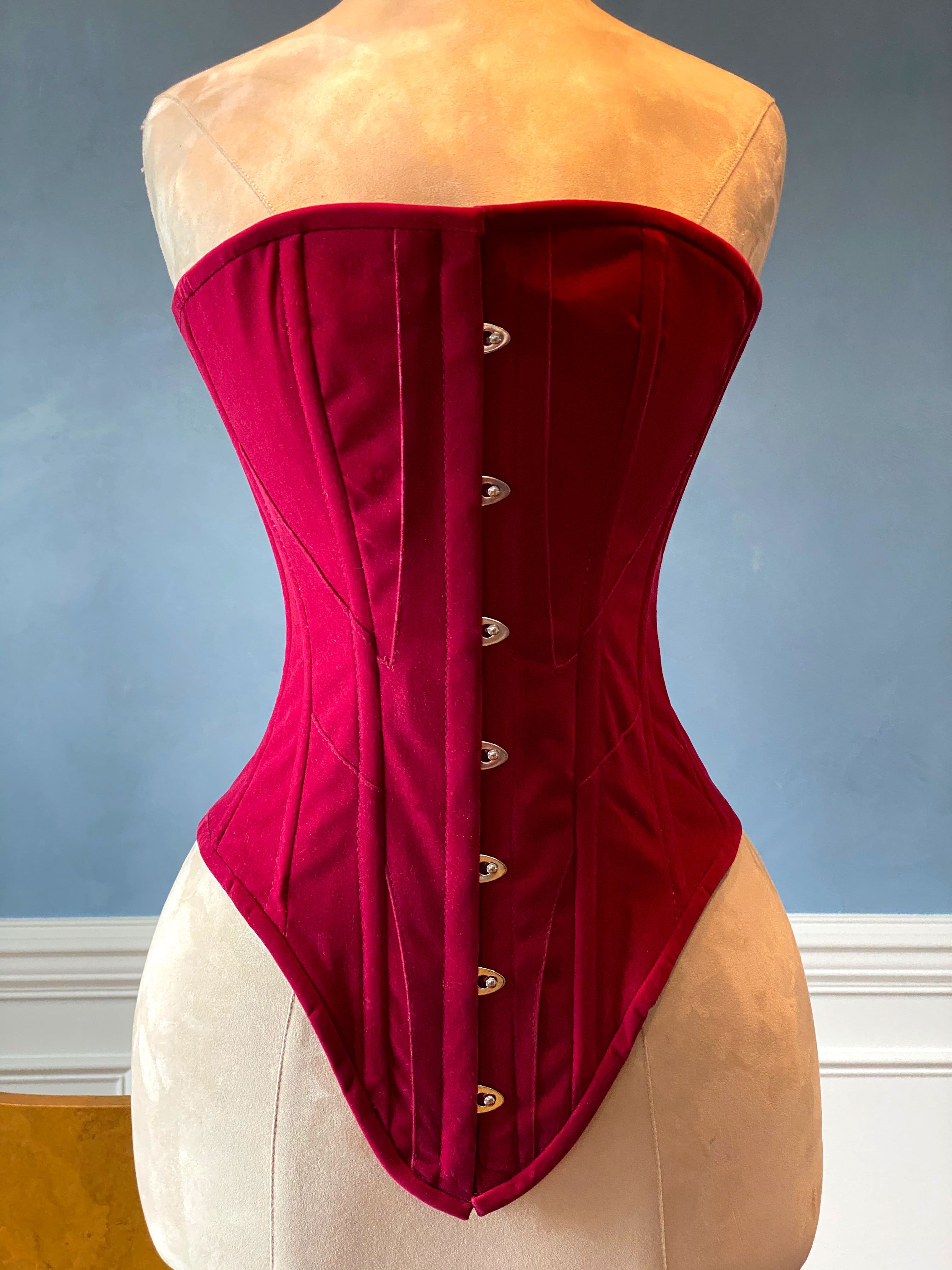 Fake pink leather Edwardian pattern PVC corset. Steelbone custom