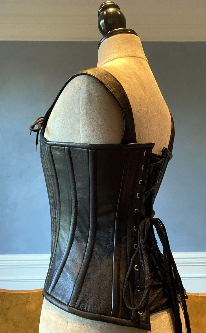 
                  
                    Lambskin full bust vintage historical pattern corset with shoulder straps (40+ steel bones). Different colors of leather are available Corsettery
                  
                