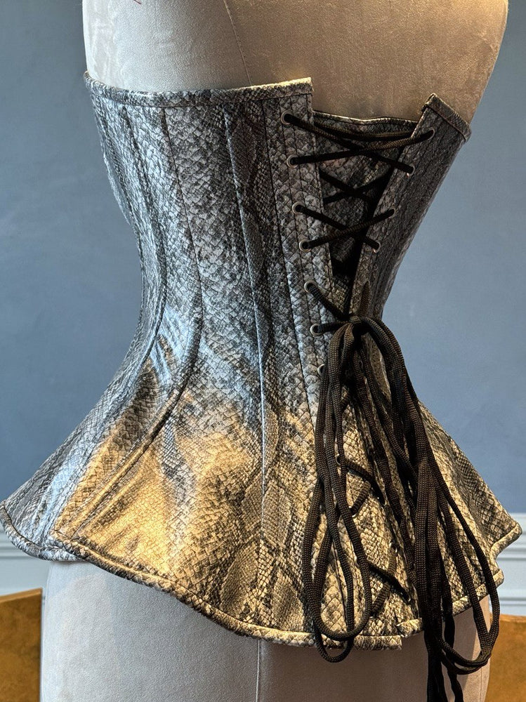 
                  
                    The Ramona Corset. Bespoke high quality authentic peplum style corset from eco snake leather (PVC) on steel bones, vintage, wedding, victorian corset.
                  
                