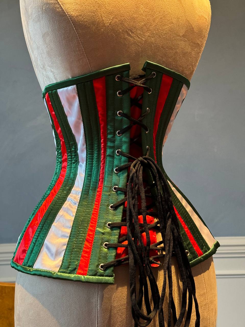 
                  
                    Underbust red and green satin in Santa style with steampunk closure hooks in the front. Corset is made personally according to your measurements.
                  
                