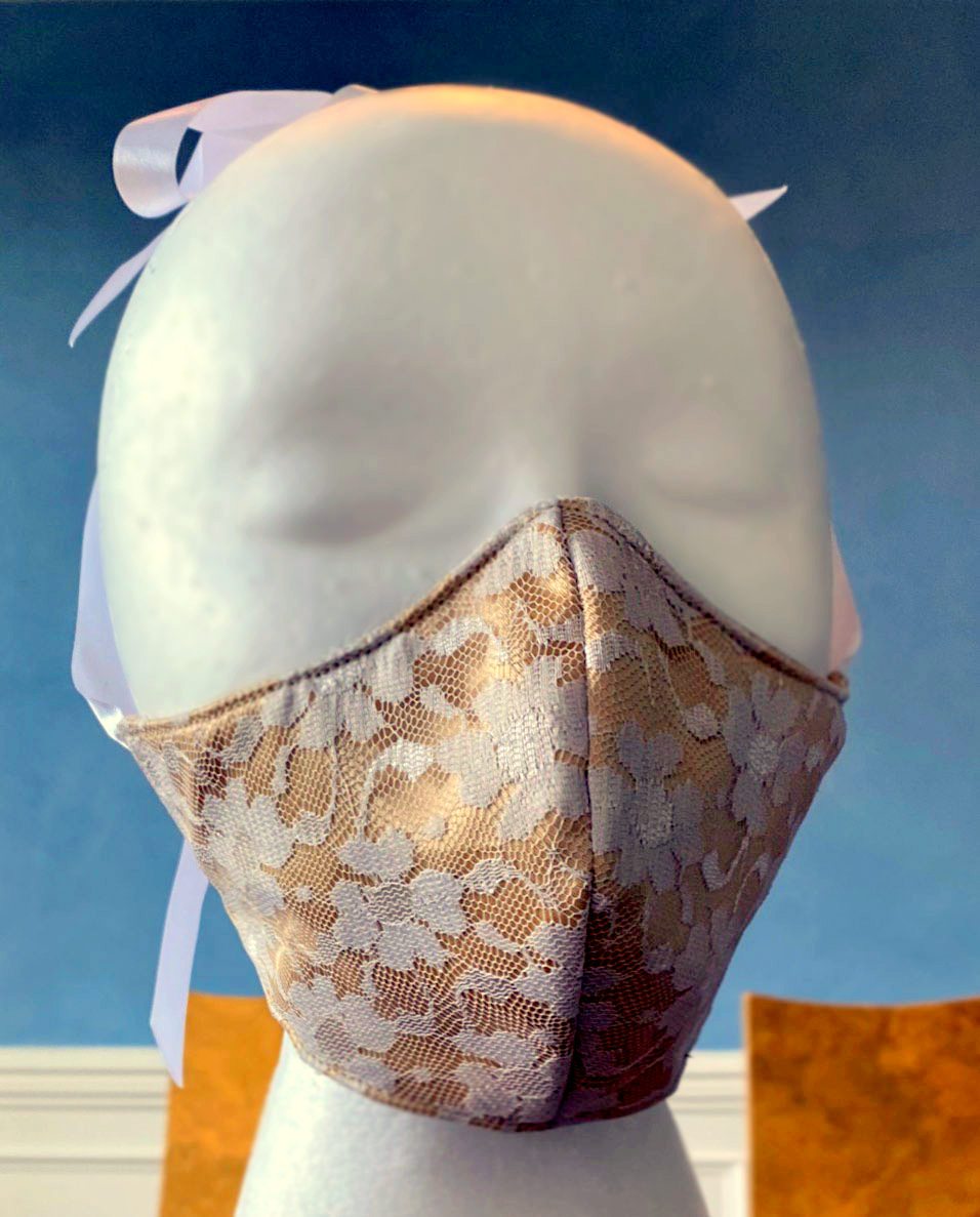 
                  
                    Wedding face cover/cloths face mask, nude satin and white laces outside, cotton inside. Around head ribbon Corsettery
                  
                