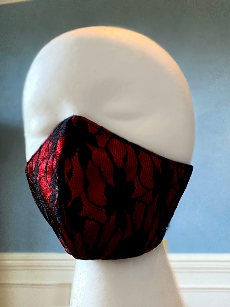 
                  
                    Fashion face cover/cloths face mask, red with black laces outside, cotton inside. Around head ribbon Corsettery
                  
                