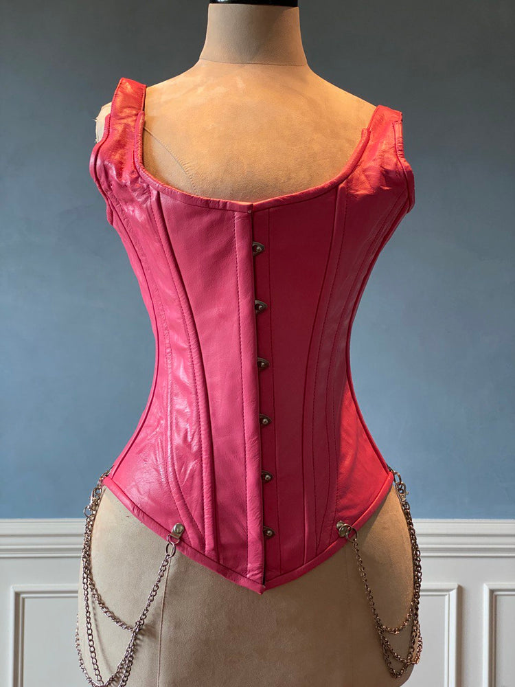 Salmon color leather corset vest with shoulder straps and chains. Steel-boned corset top for tight lacing.
