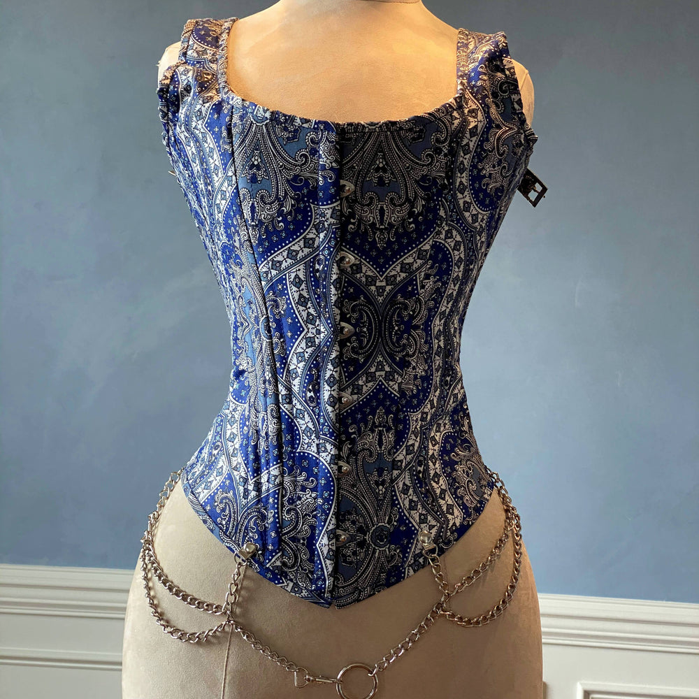 
                  
                    Classic brocade overbust corset vest inspired by Audrey Hepburn with shoulder straps. Steel-boned corset top for tight lacing. Corsettery Authentic Corsets USA
                  
                