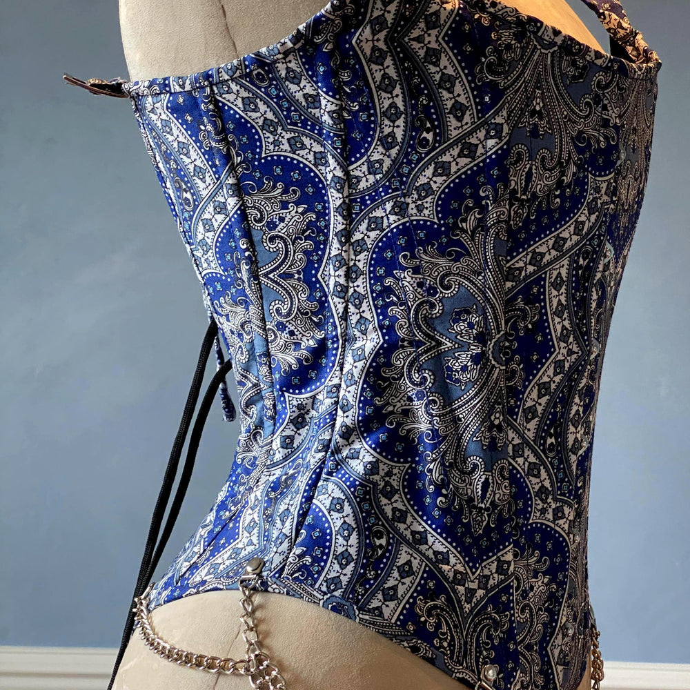 
                  
                    Classic brocade overbust corset vest inspired by Audrey Hepburn with shoulder straps. Steel-boned corset top for tight lacing. Corsettery Authentic Corsets USA
                  
                