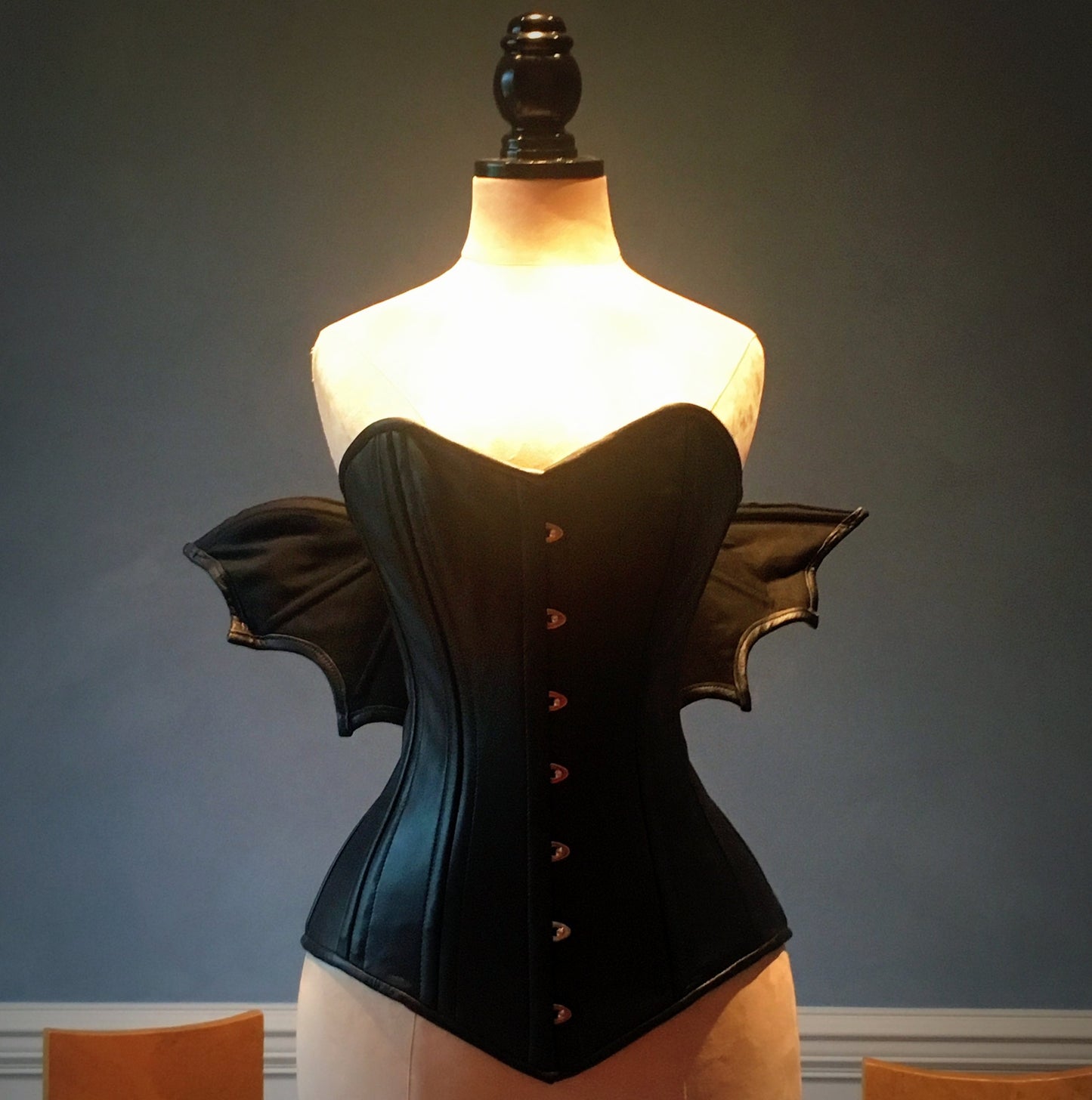
                  
                    Black real leather corset with bat wings designed by Porcelain Panic, all steel boned Corsettery
                  
                
