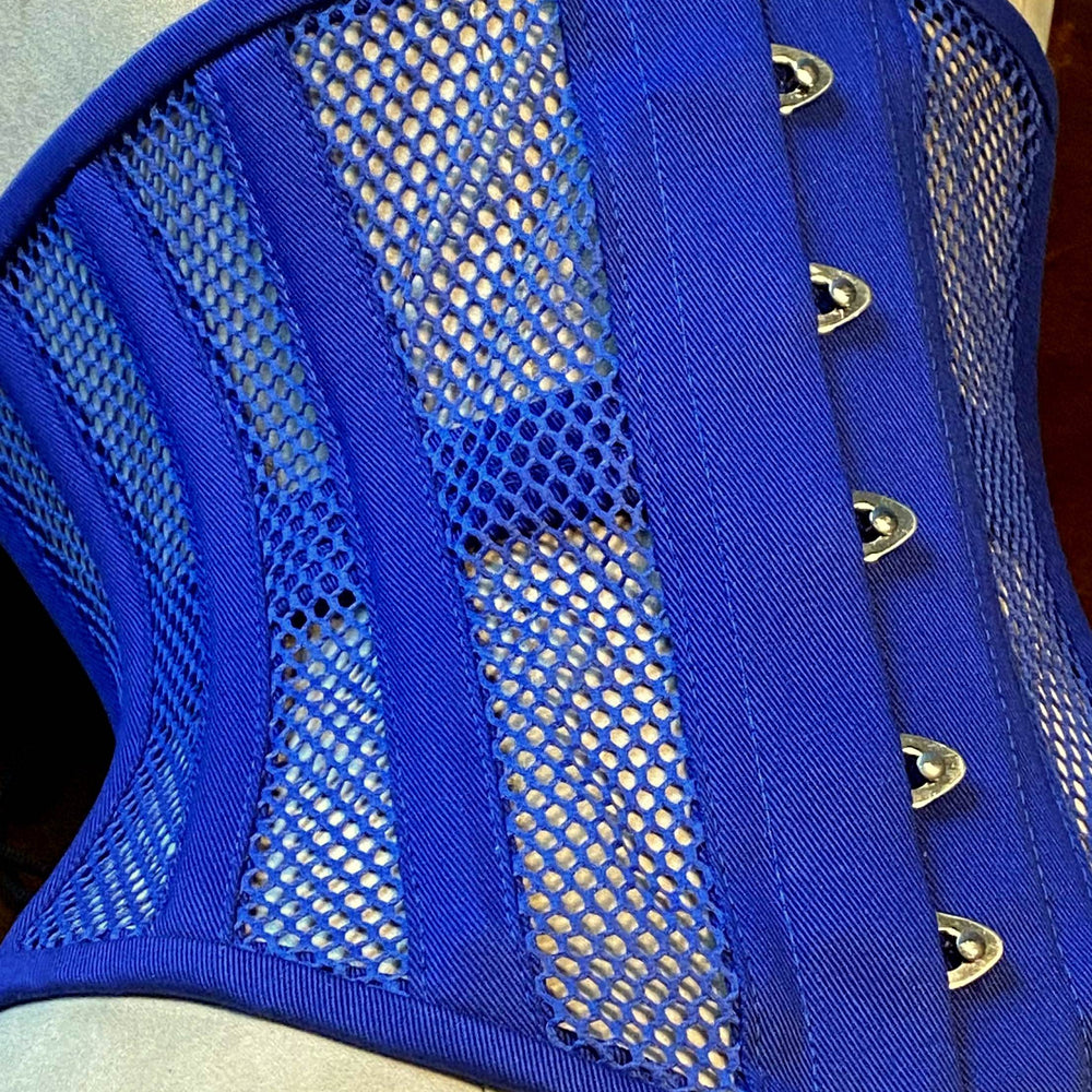 
                  
                    Real steel boned underbust corset from blue transparent mesh and cotton. Real waist training corset for tight lacing. Corsettery
                  
                