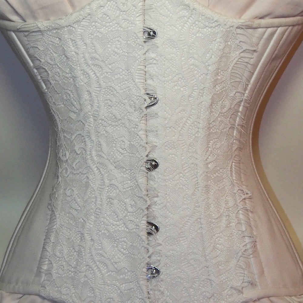 
                  
                    Exclusive white bridal steel-boned corset for tight lacing covered by laces. Lace Addicted Corsettery collection. Wedding, bridal corset Corsettery
                  
                