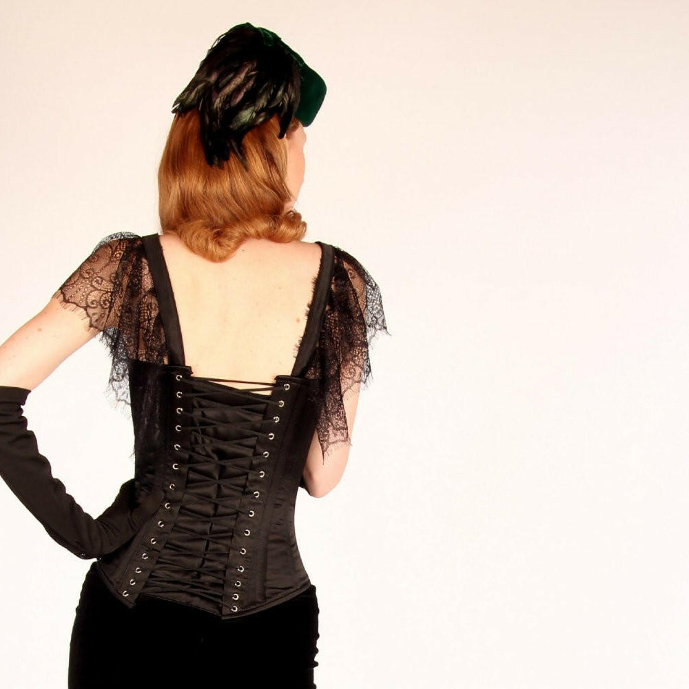 
                  
                    The Mildred Corset. Bespoke high quality authentic corset with brooch and laces on steel bones Corsettery
                  
                