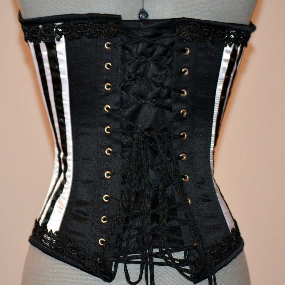 
                  
                    Long black and white satin corset with black lace trim. Gothic, historical, steampunk, prom, gift corset, couture, steel-boned, Victorian Corsettery
                  
                