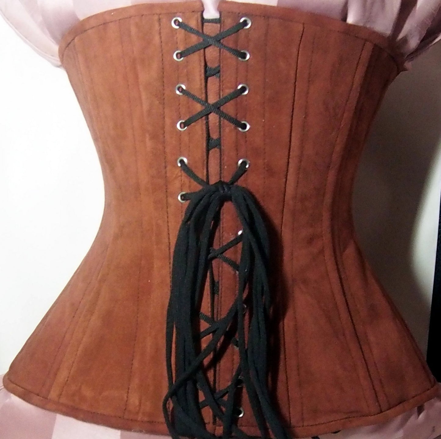 
                  
                    Real double row steel boned underbust corset from lambskin suede. Exclusive steampunk historical corset with double rows of bones. Western Corsettery
                  
                