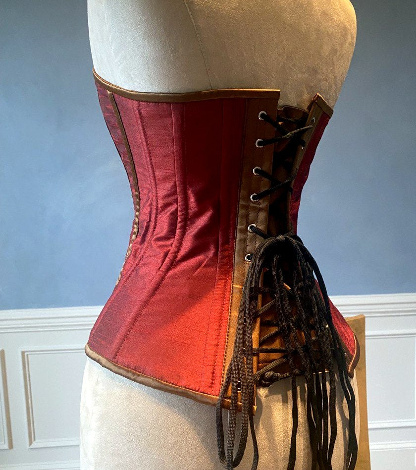 
                  
                    Classic taffeta corset red and black. Steel-boned corset for tight lacing. Prom, gothic, steampunk Victorian corset. Corsettery
                  
                