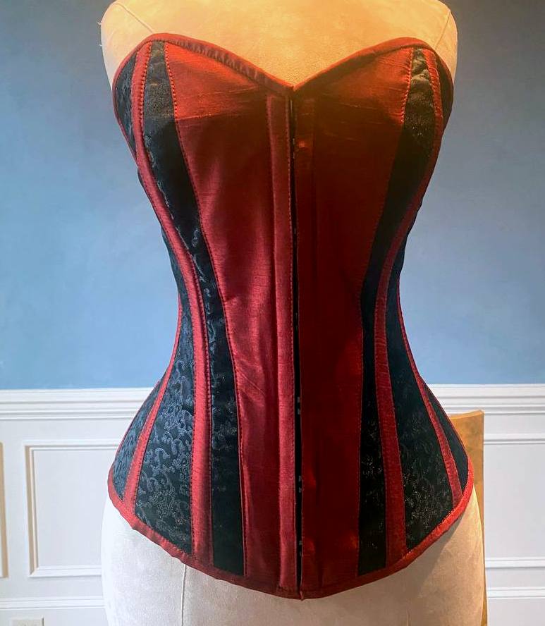 
                  
                    Classic black brocade corset with red taffeta and hidden busk. Gothic Victorian, steampunk affordable corset Corsettery
                  
                