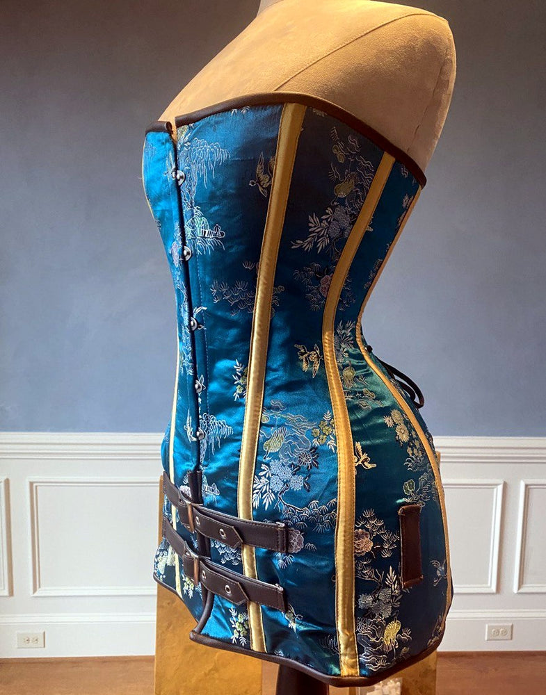 Exclusive blue brocade corset in caftan style, colorful blue with brown leather steampunk and all black gothic available Corsettery