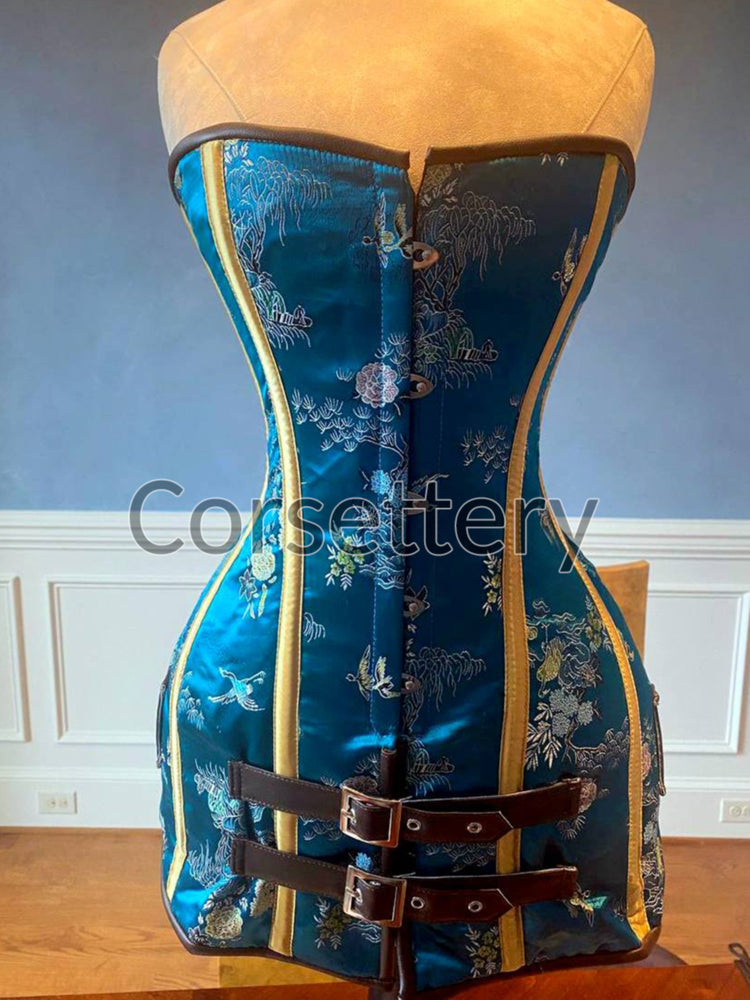 
                  
                    Exclusive blue brocade corset in caftan style, colorful blue with brown leather steampunk and all black gothic available Corsettery
                  
                